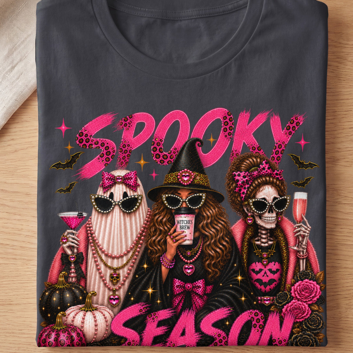 Three fashionable Halloween characters with "Spooky Season" text.