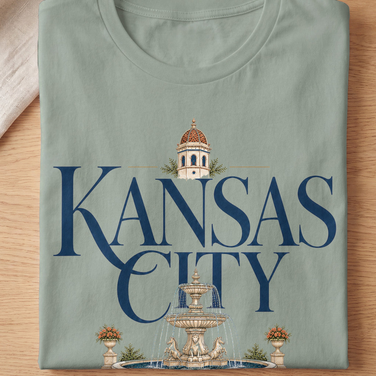 T-shirt with "Kansas City" text, a dome tower, and a fountain.