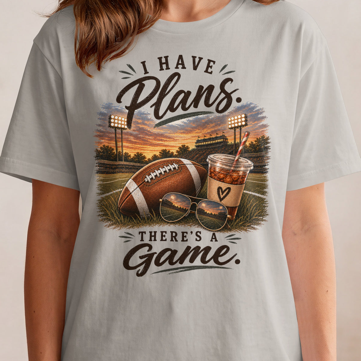 I have plans. There's a game. Football, drink, and sunglasses on a field.