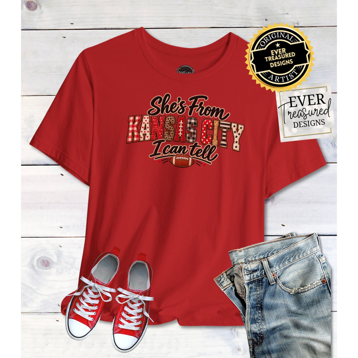 Red t-shirt with "She's From Kansas City I Can Tell" graphic and football.