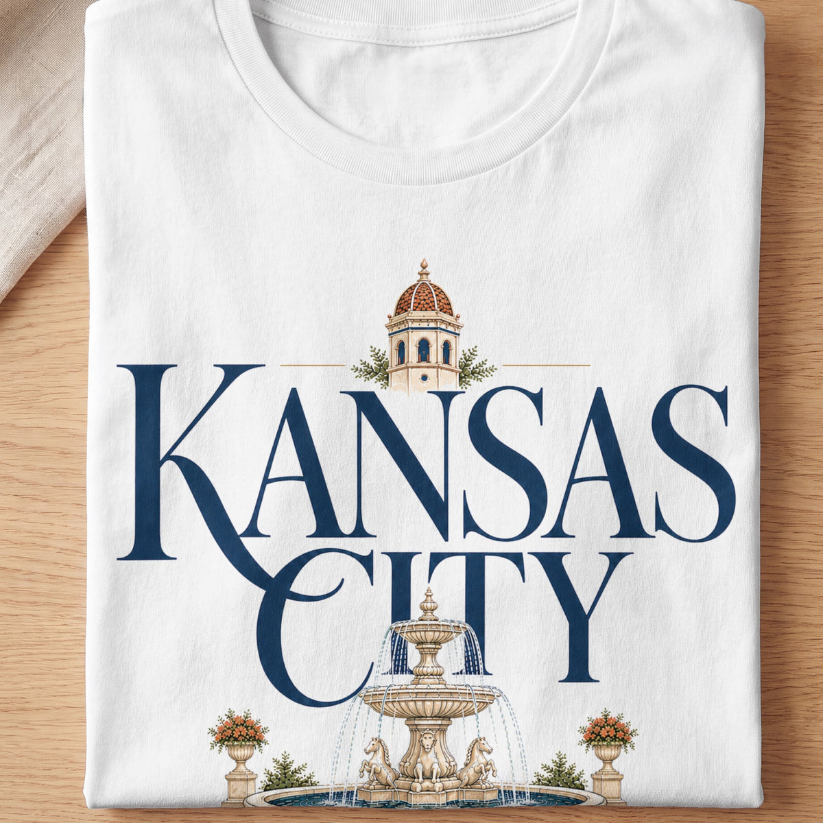 White t-shirt with "Kansas City" text, a dome building, and a fountain.