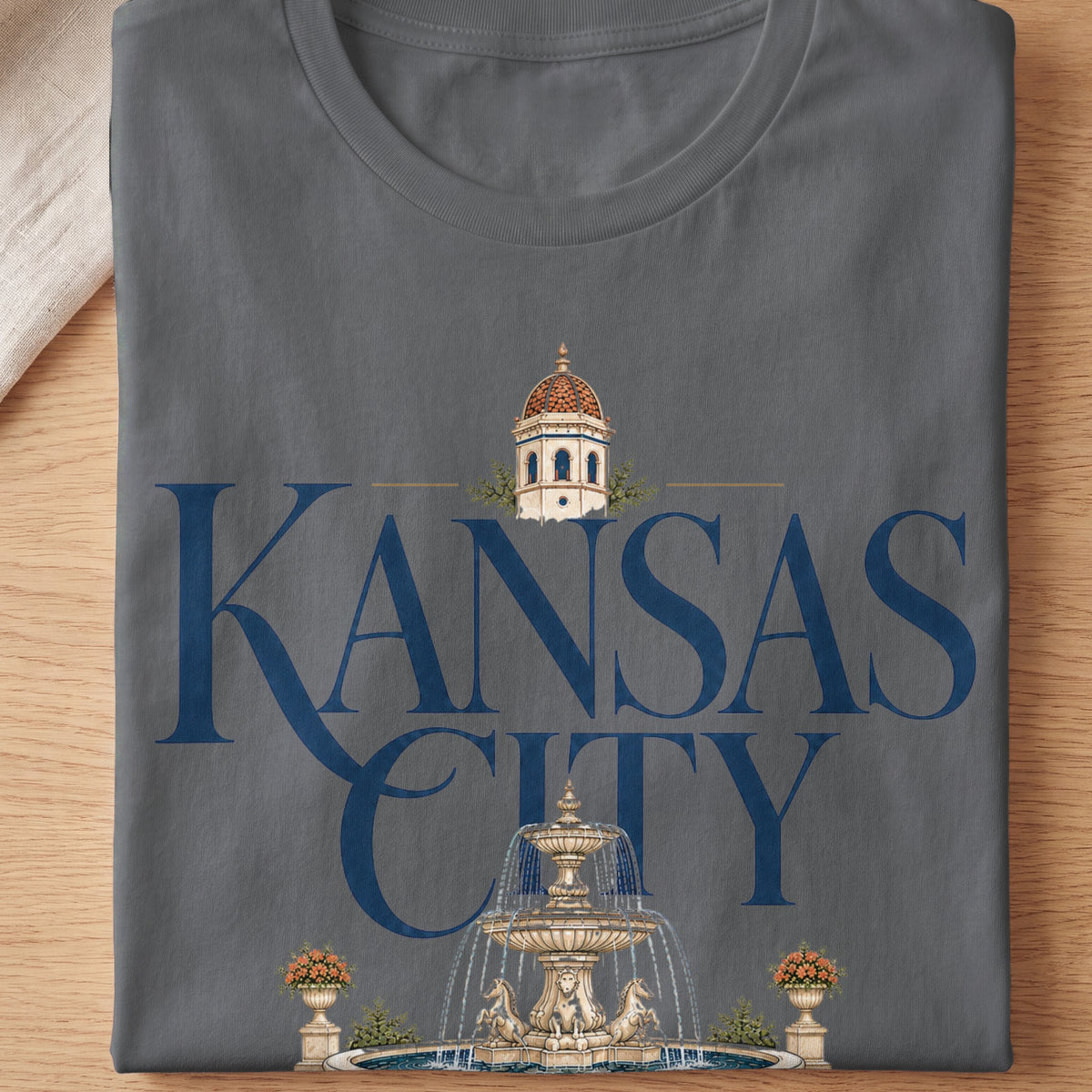 Gray t-shirt with "Kansas City" text, domed building, and fountain graphic.