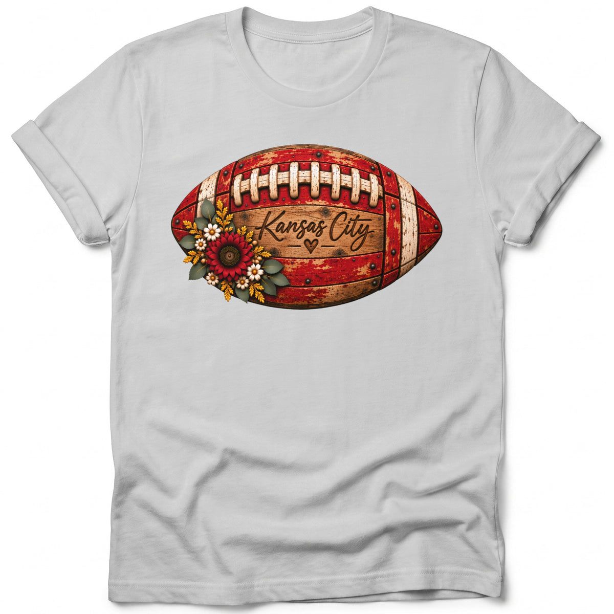 T-shirt with a distressed football graphic featuring "Kansas City" and floral accents.