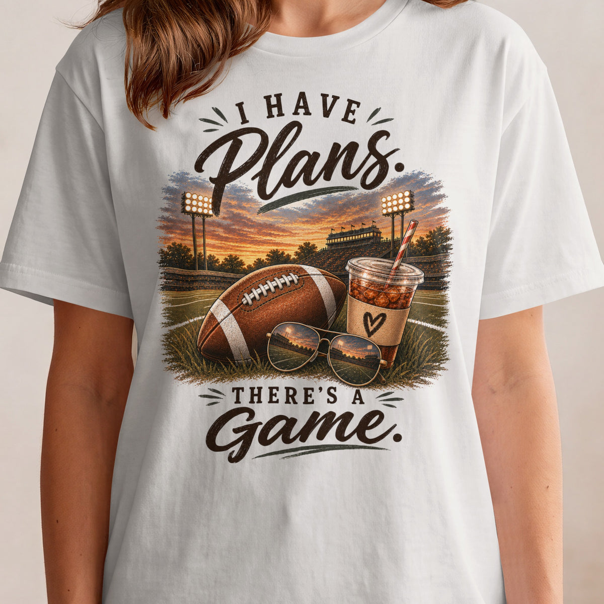 I have plans, there's a game. Football, drink, sunglasses on stadium field.