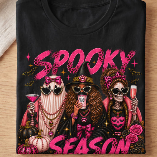 Spooky Season text with a ghost, witch, and skeleton adorned with pink and leopard print.