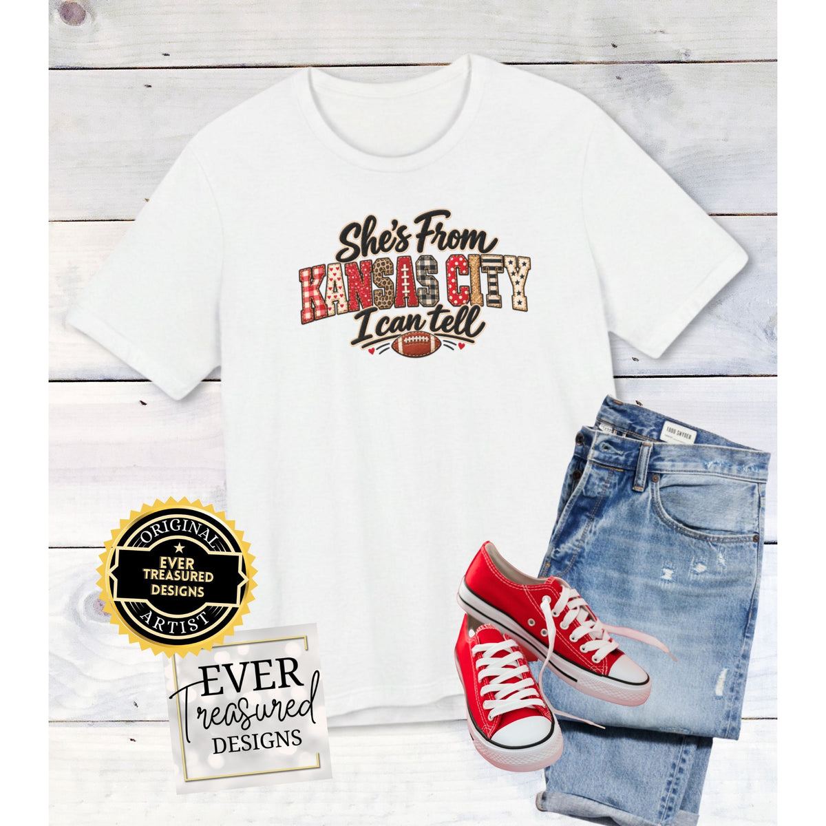 White t-shirt with "She's From Kansas City I Can Tell" design and football graphic.