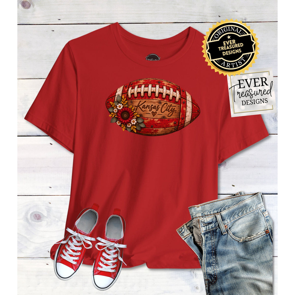 Red t-shirt with distressed Kansas City football graphic and floral accents.