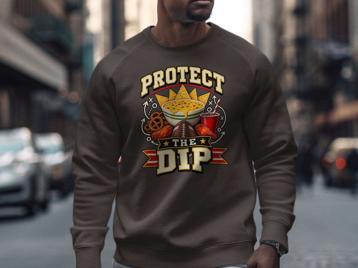 Brown sweatshirt with "Protect The Dip" text and football game snacks graphic.
