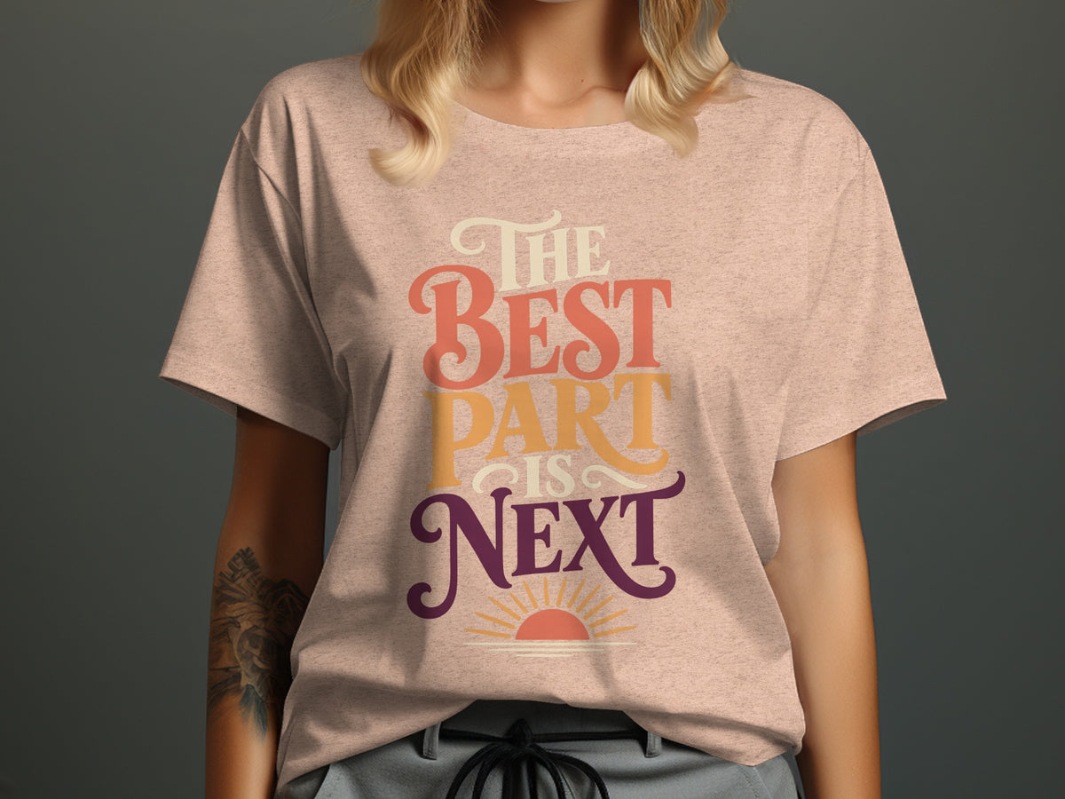 Peach t-shirt with "The Best Part is Next" text and a sunrise graphic.