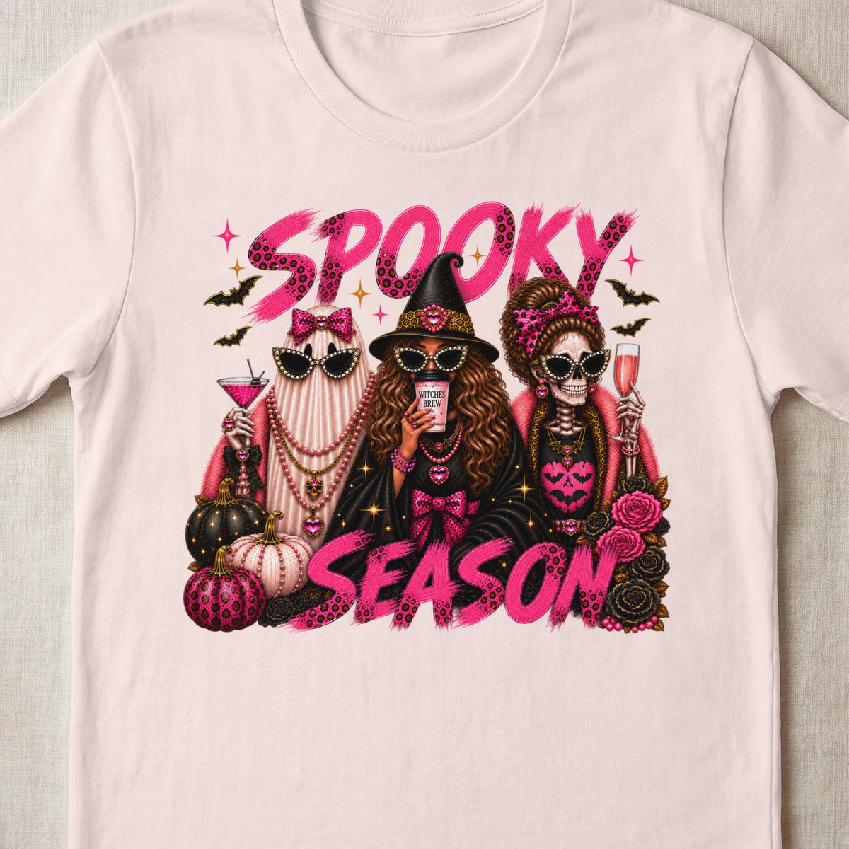 "Spooky Season" text with witch, ghost, and skeleton friends surrounded by pumpkins and roses.