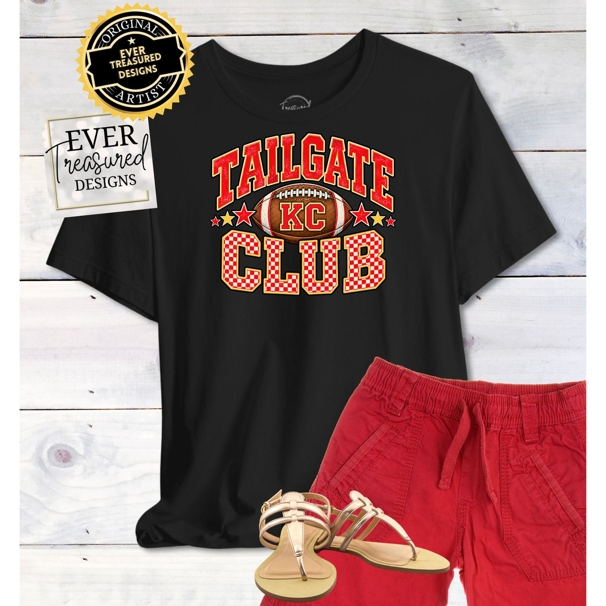 Black t-shirt with "Tailgate Club KC" graphic, red shorts, and gold sandals.