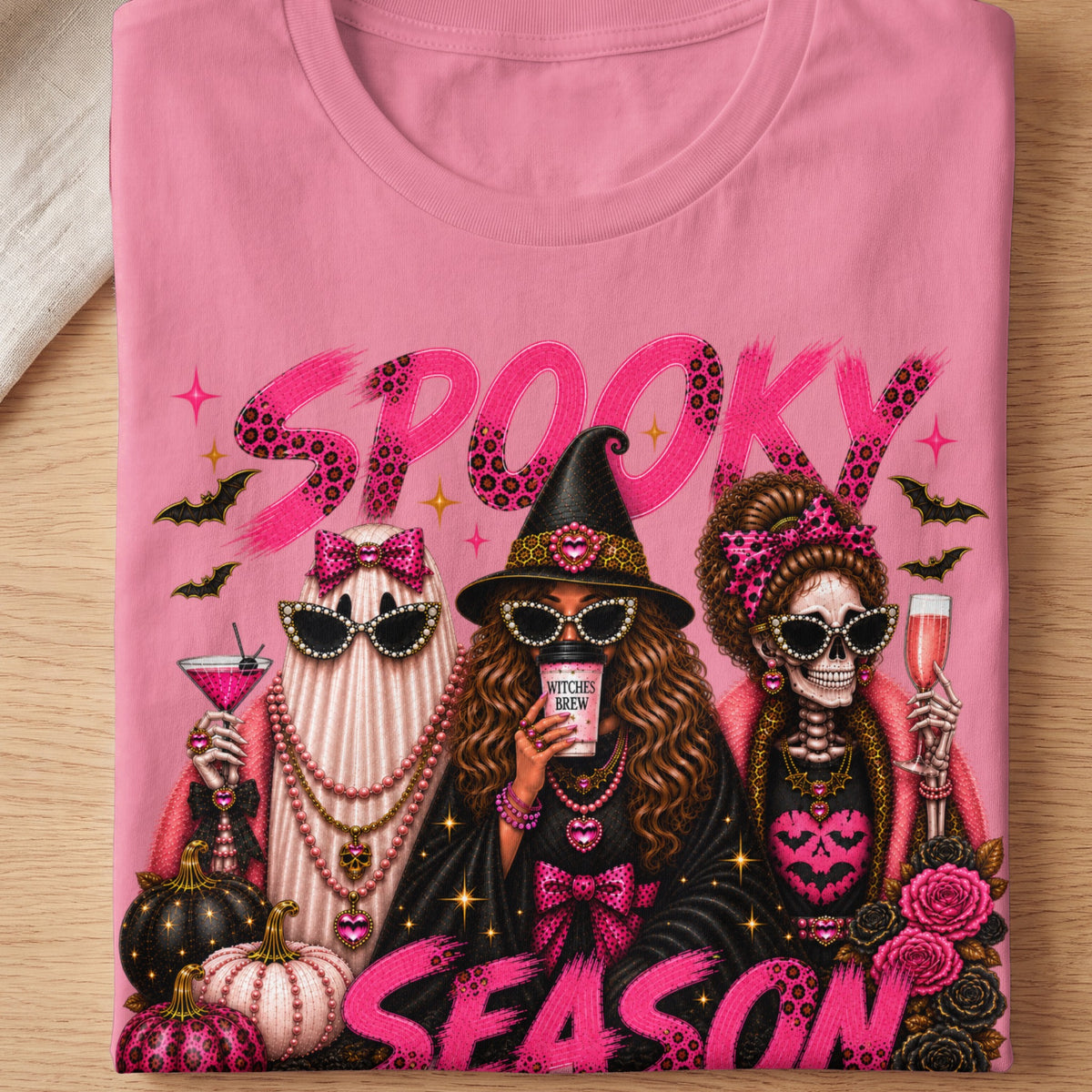 Pink t-shirt with "SPOOKY SEASON" text and Halloween characters.