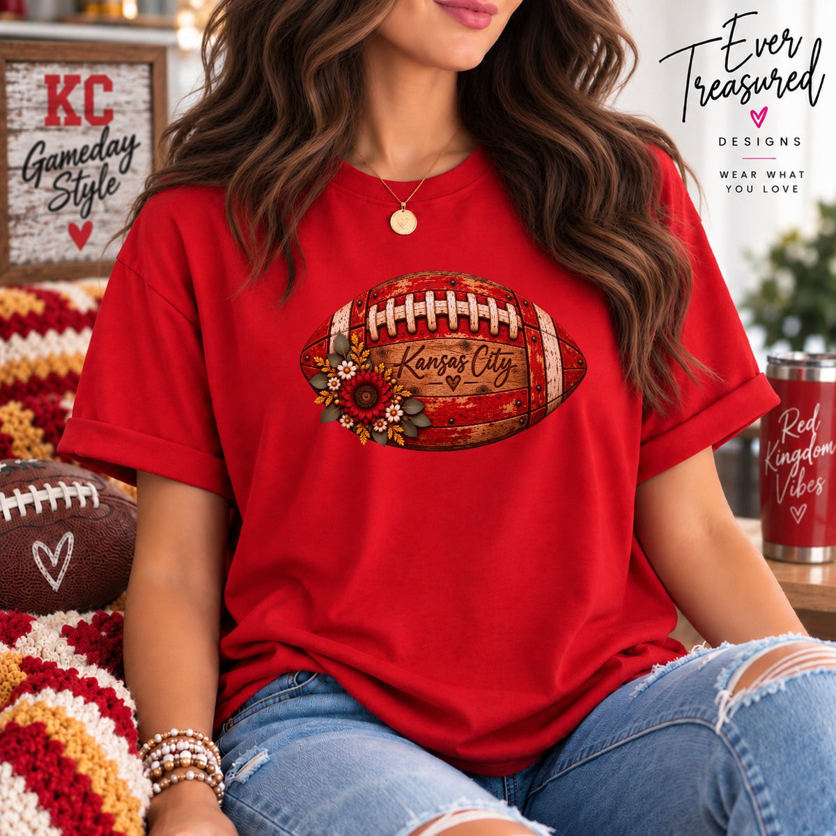 Red t-shirt with a distressed football graphic featuring "Kansas City" and flowers.