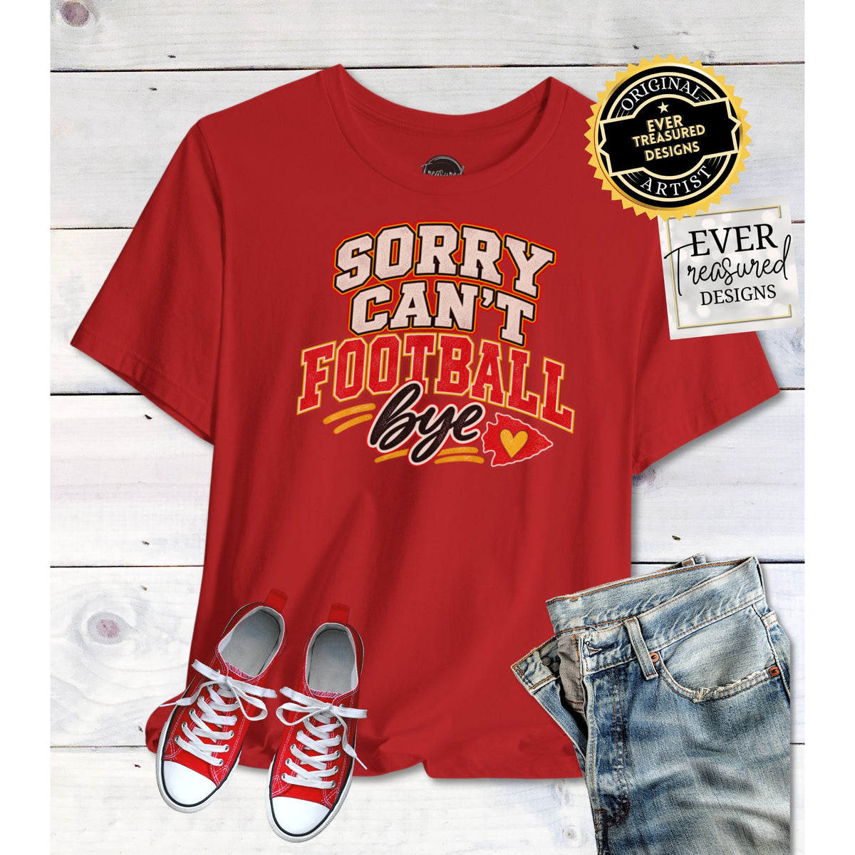 Red t-shirt with "Sorry Can't Football Bye" text and a heart arrowhead graphic.
