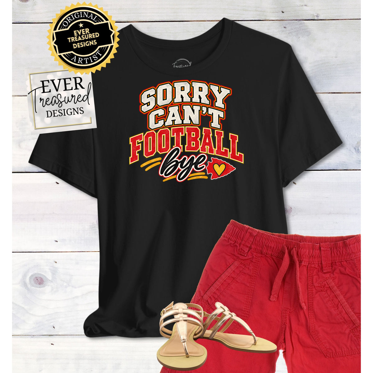 Black t-shirt with "Sorry Can't Football Bye" text, red shorts, and gold sandals.