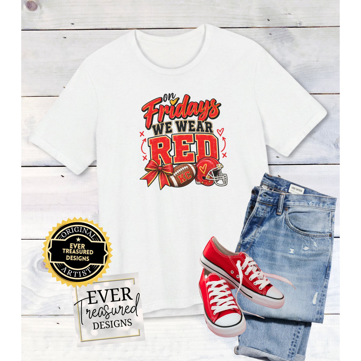 White t-shirt with "On Fridays We Wear Red" and football graphics, paired with jeans and red sneakers.