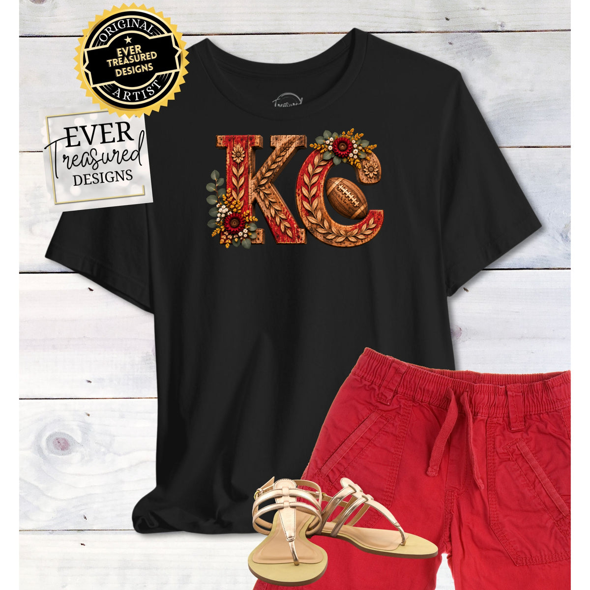 Black t-shirt with "KC" design and football, paired with red shorts and gold sandals.