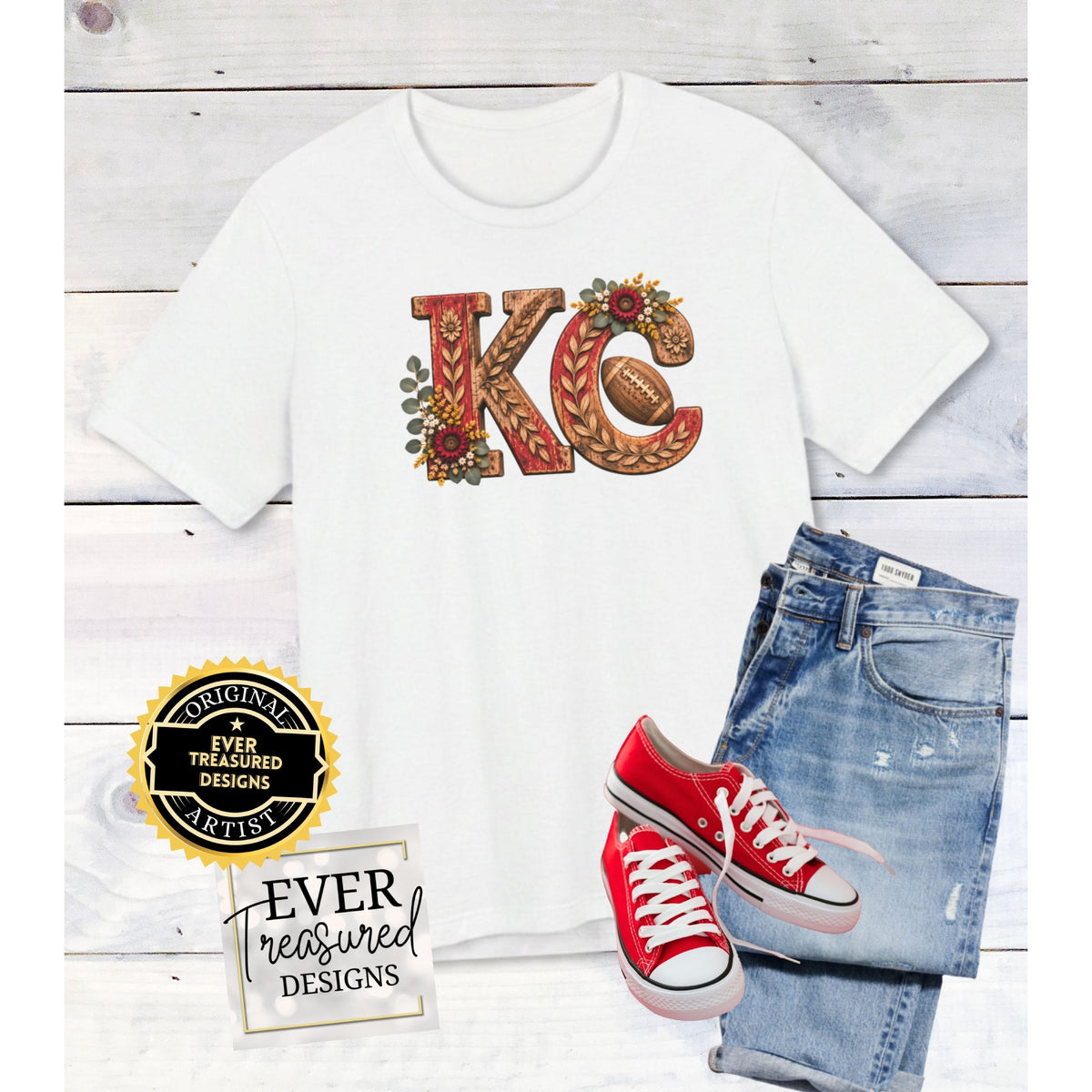 White t-shirt with "KC" design, football, jeans, and red sneakers.