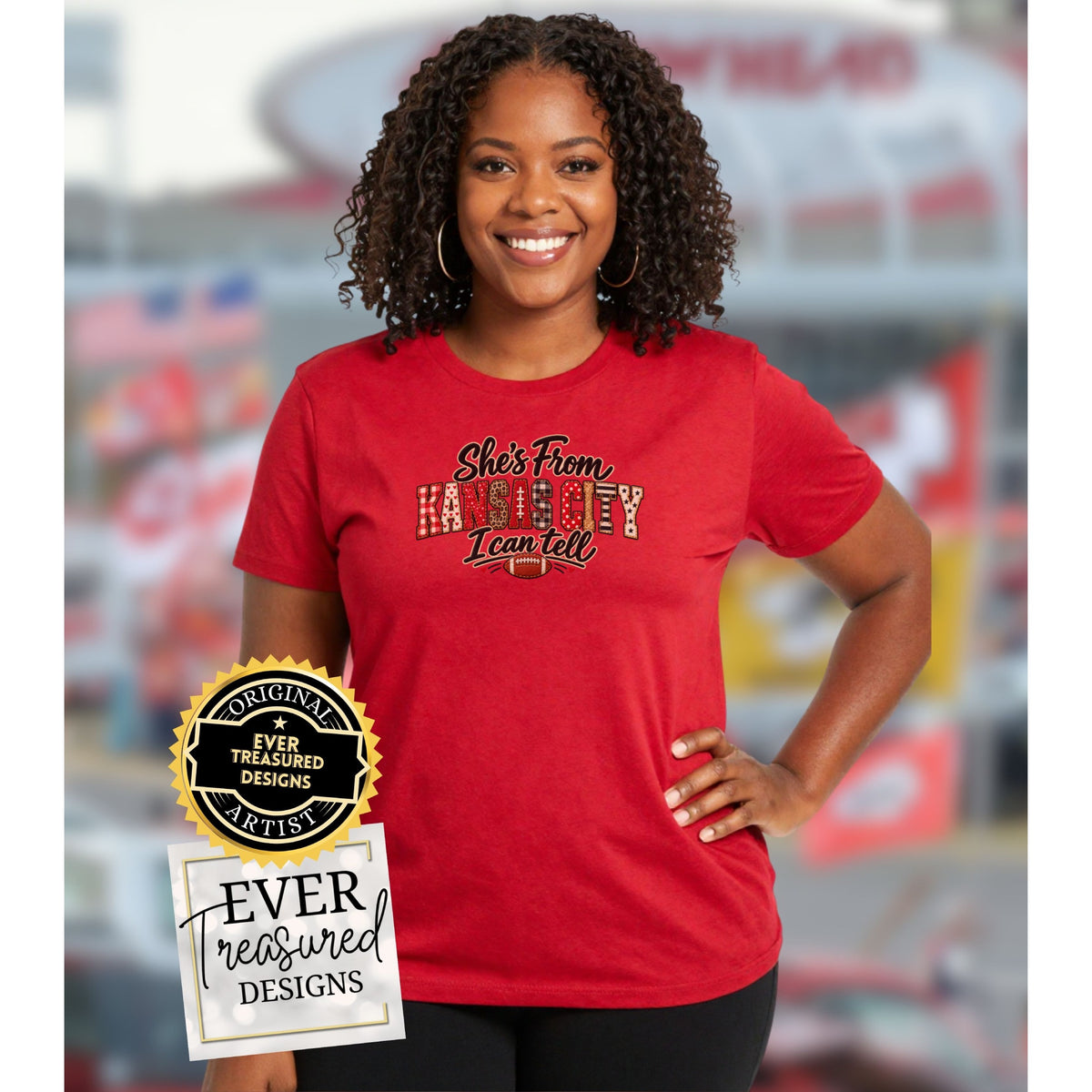 Red t-shirt with "She's From KANSAS CITY I can tell" text and football graphic.