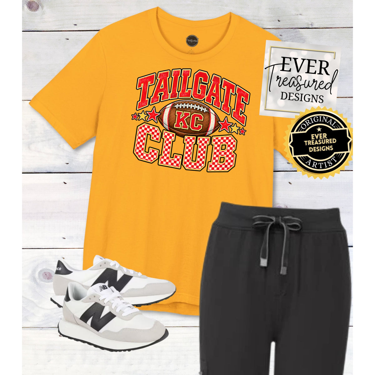 Gold t-shirt with "Tailgate Club" and KC football graphic, black joggers, and white sneakers.