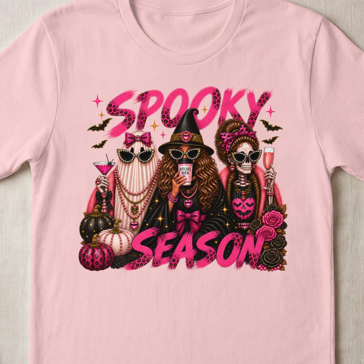 Spooky Season text with ghost, witch, and skeleton holding drinks, surrounded by pumpkins and roses.