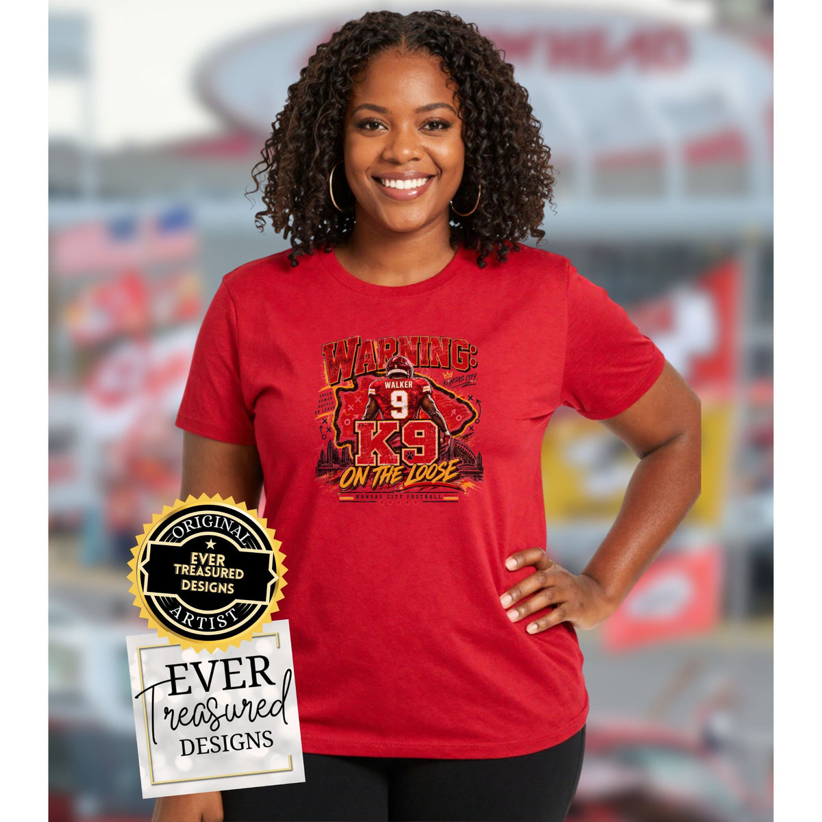 Red t-shirt with graphic of football player and text "WARNING: K9 ON THE LOOSE".