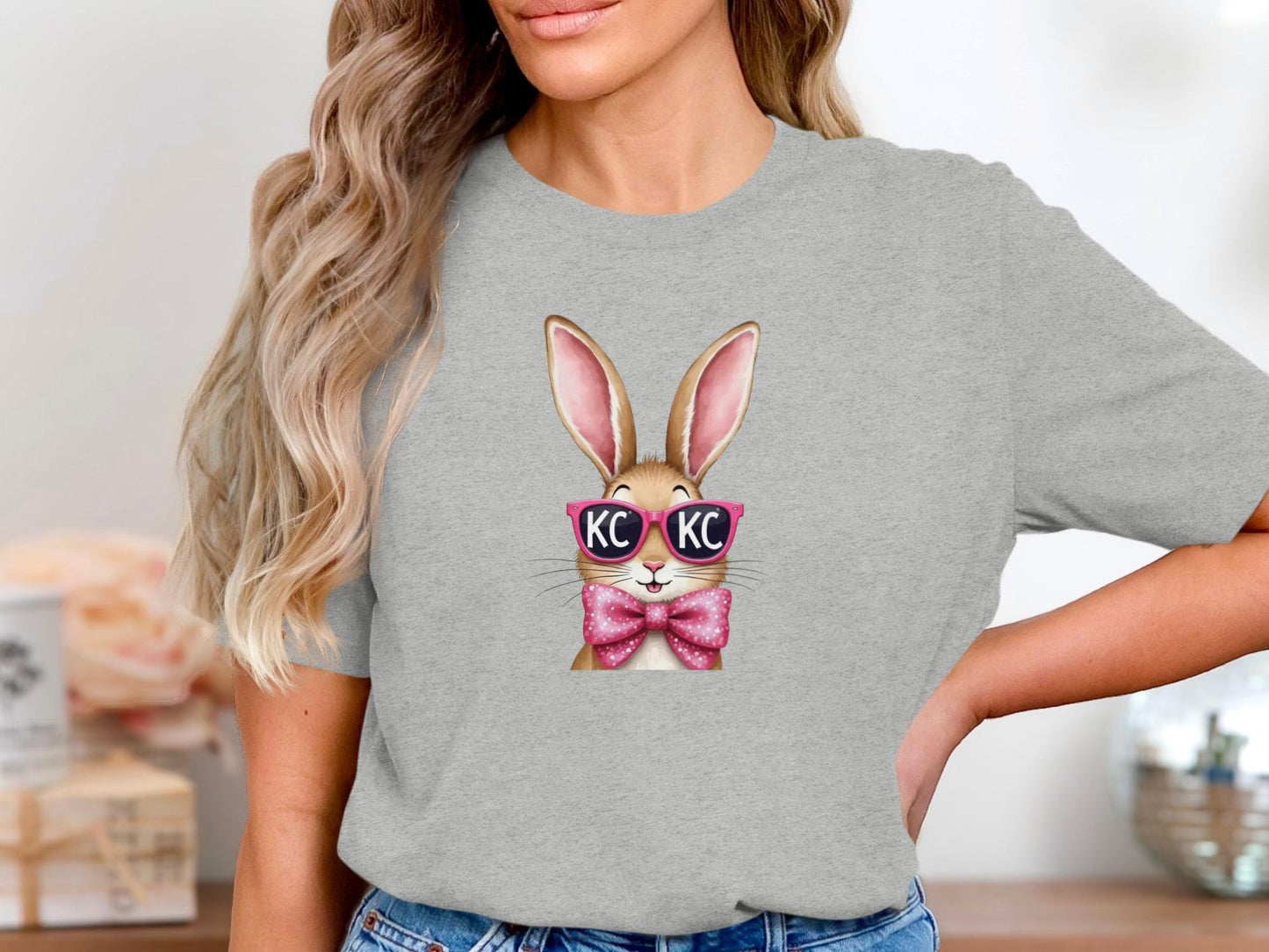 Gray t-shirt with cartoon bunny wearing pink sunglasses and a bow tie.