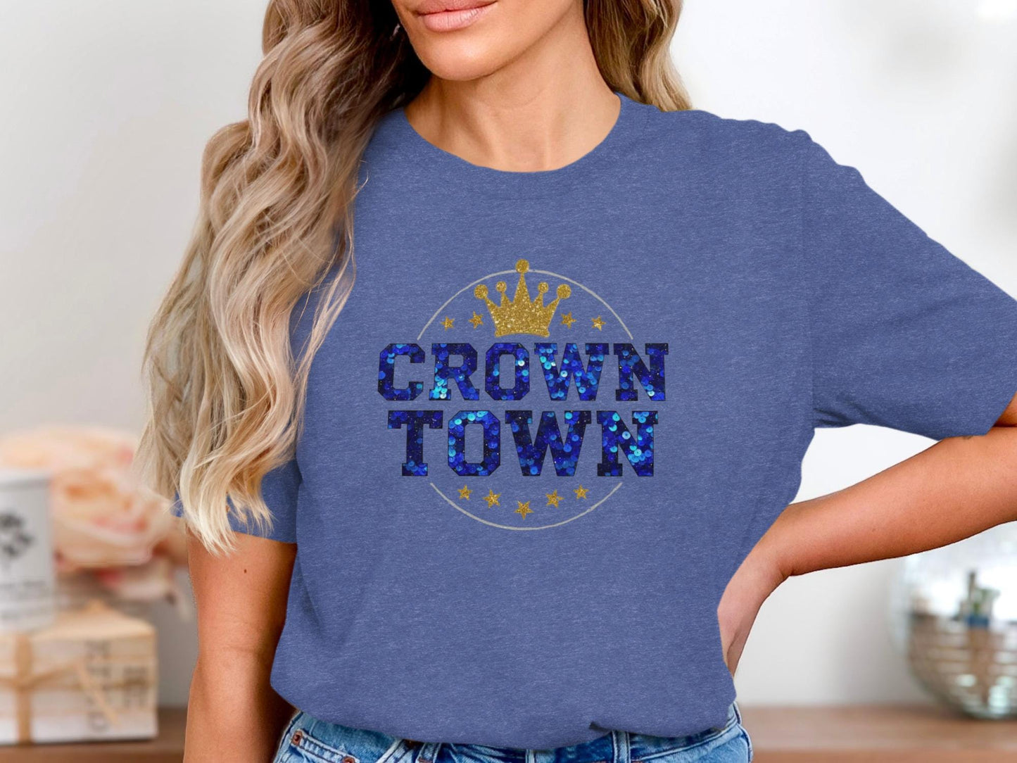 Blue t-shirt with "Crown Town" text in sparkly blue letters and a gold crown.