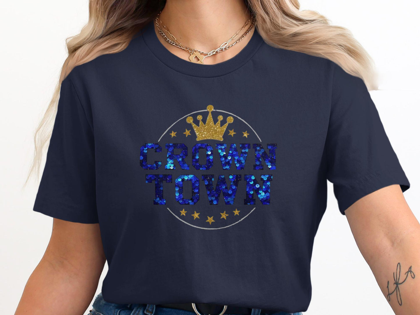 Dark blue t-shirt with sequined "CROWN TOWN" text and crown graphic.