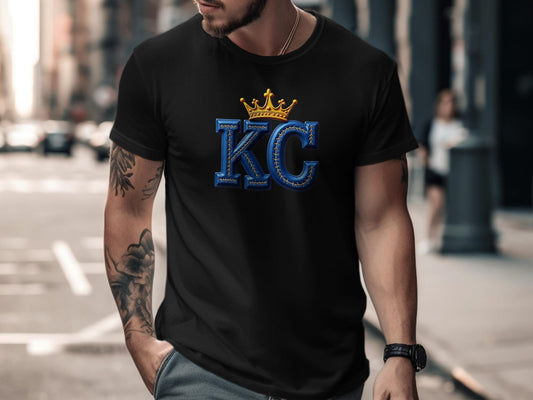 Black t-shirt with large blue KC letters and a gold crown logo.