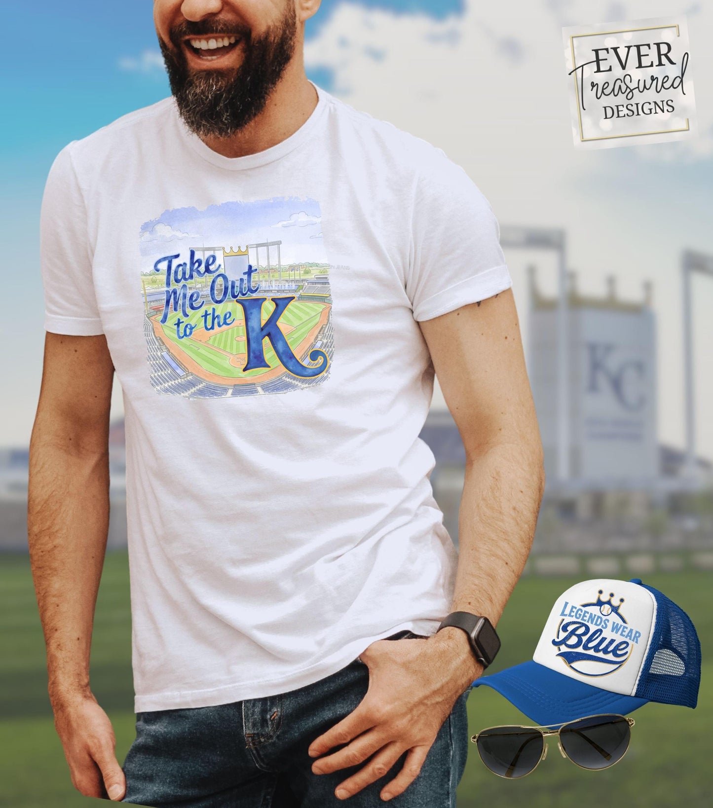 White t-shirt with "Take Me Out to the K" text and a baseball stadium graphic.