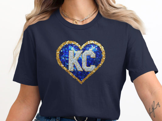 Navy t-shirt with sequined blue and gold KC heart.