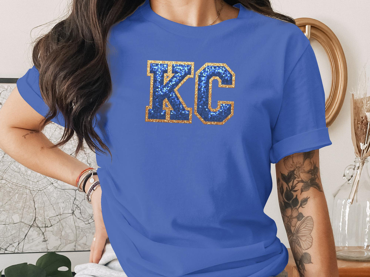 Blue t-shirt with glittery gold KC letters on chest