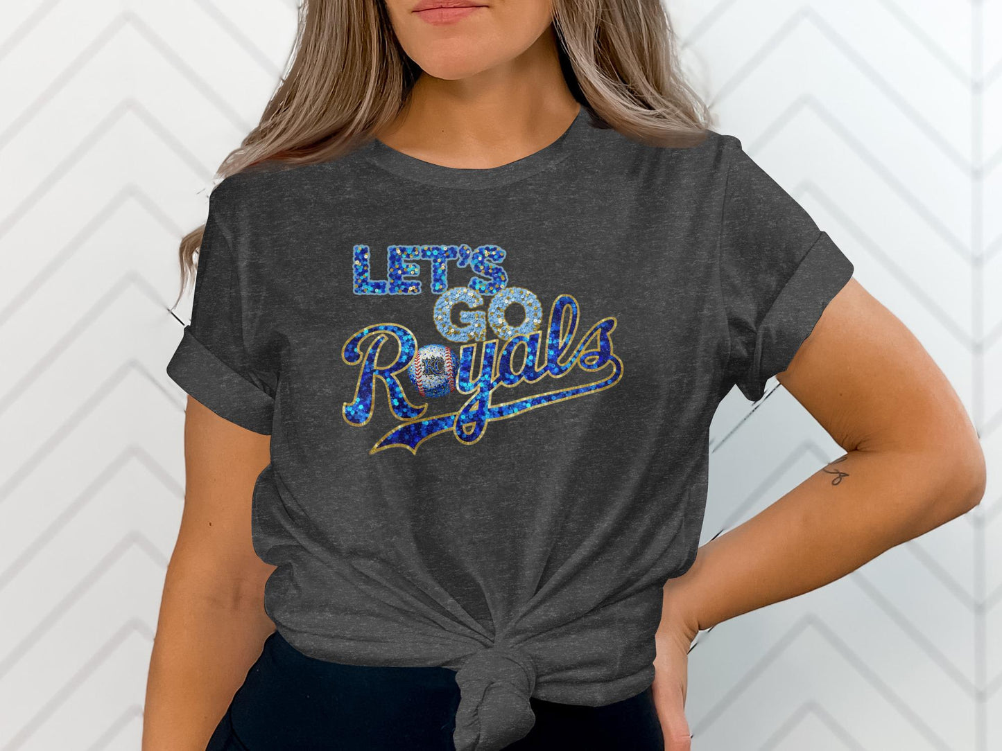 Dark grey t-shirt with "Let's Go Royals" in glittery text.