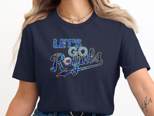 Navy t-shirt with "Let's Go Royals" in sparkly blue and gold lettering.