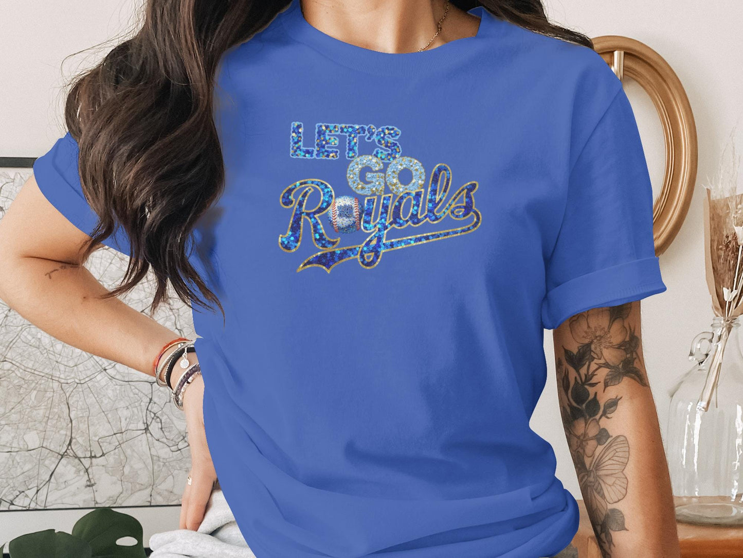 Blue t-shirt with "Let's Go Royals" glitter text.