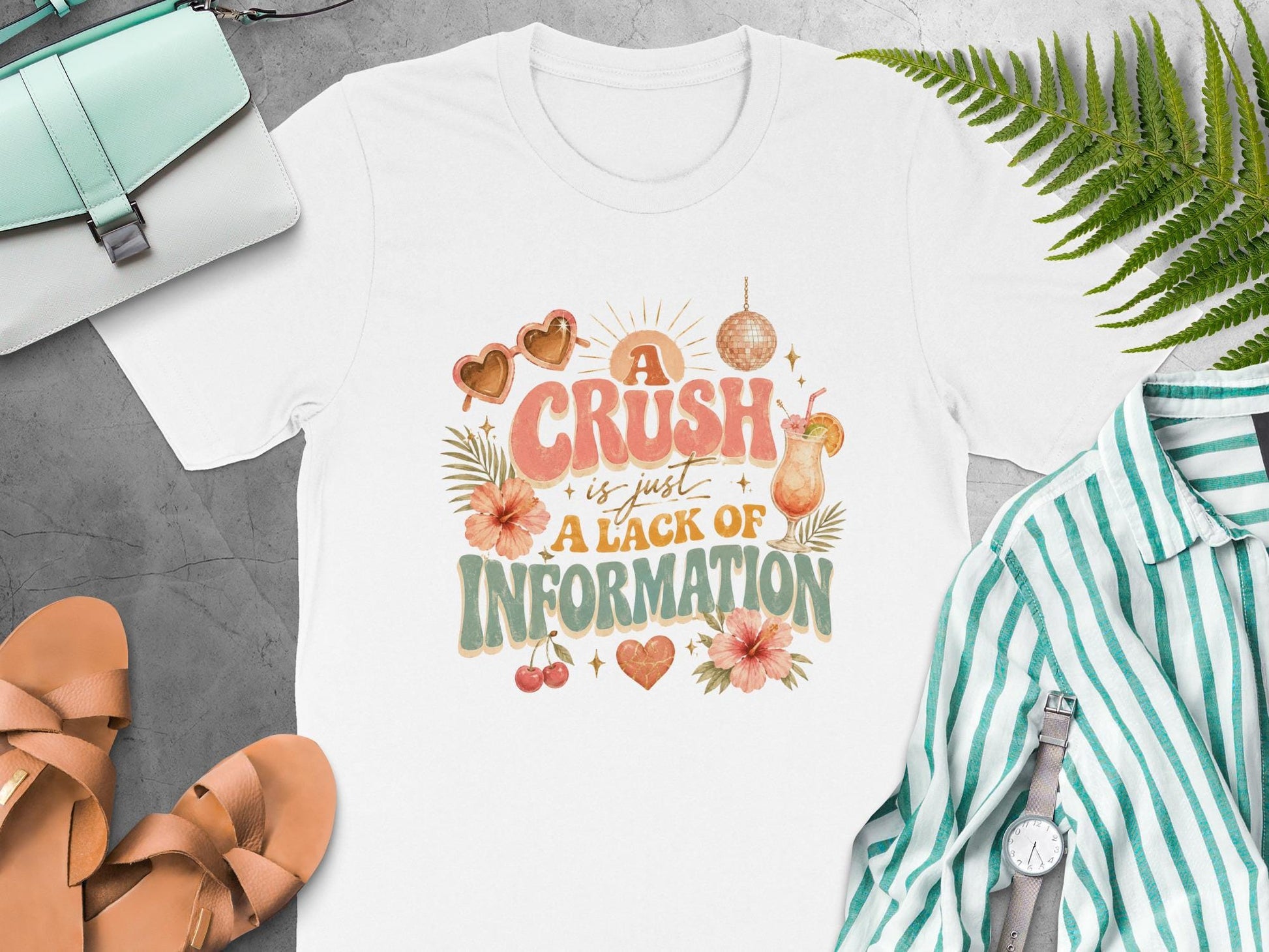 White t-shirt with "A crush is just a lack of information" graphic.