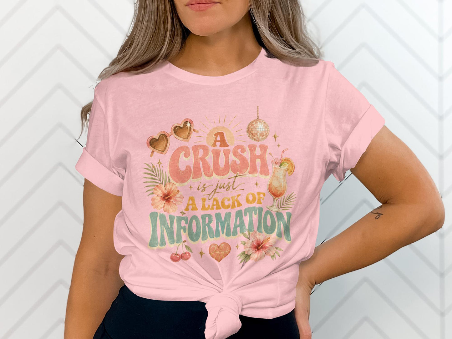 Pink t-shirt with "A Crush is just a Lack of Information" graphic.