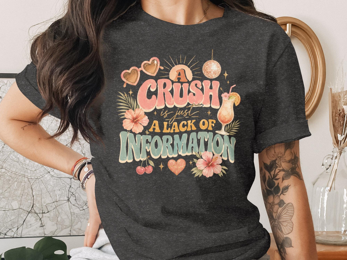 Dark t-shirt with retro graphic that reads "A crush is just a lack of information."