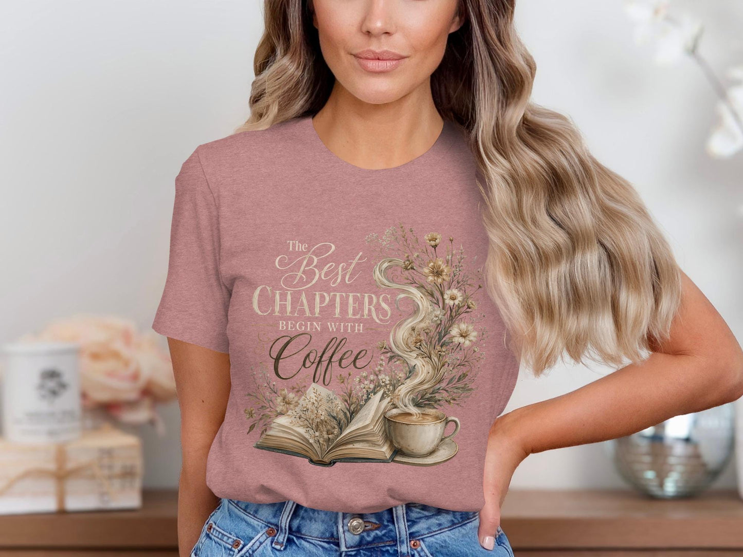 Pink t-shirt with "The Best Chapters Begin With Coffee" text and floral design.