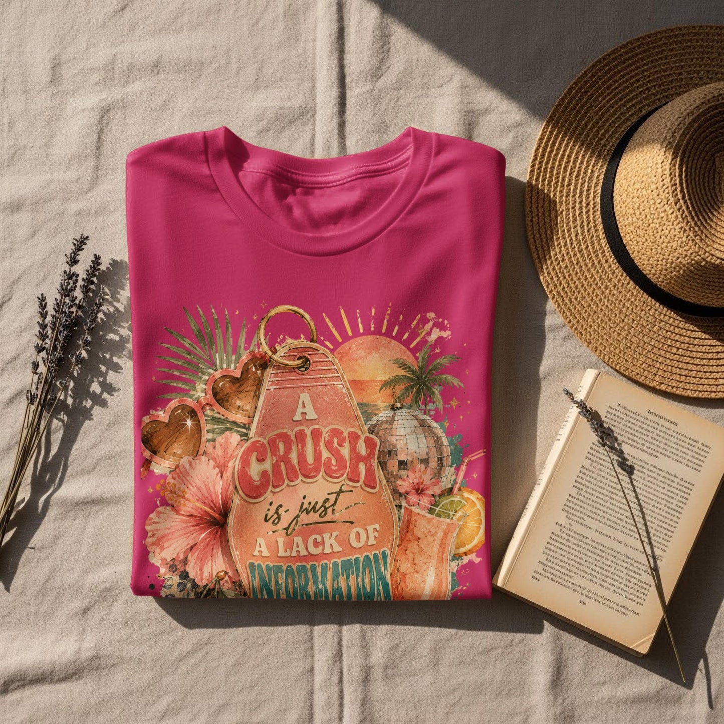 Pink t-shirt with retro graphic and text "A crush is just a lack of information".