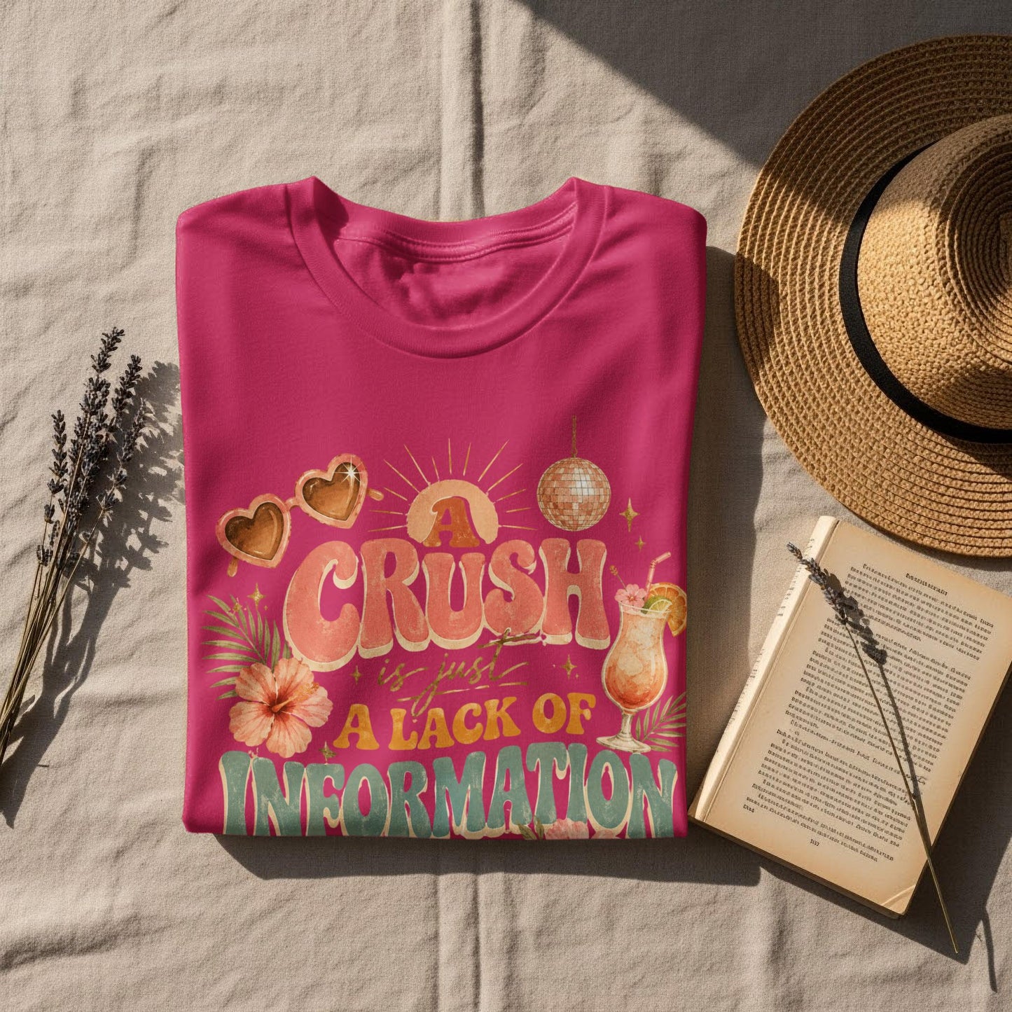 Pink t-shirt with text "A Crush is just A Lack of Information" and retro graphics.