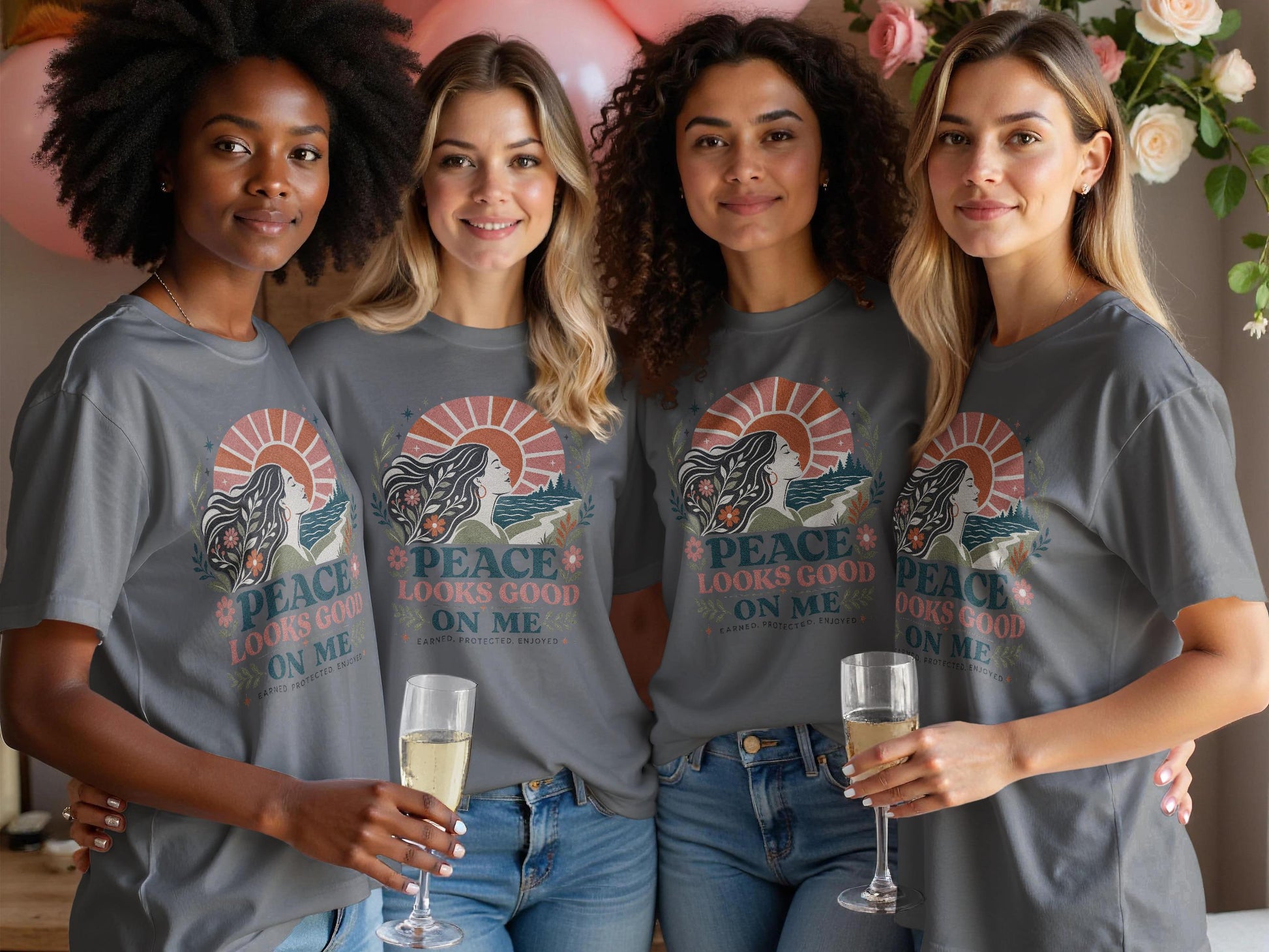 Four women in grey t-shirts with "Peace Looks Good On Me" graphic.