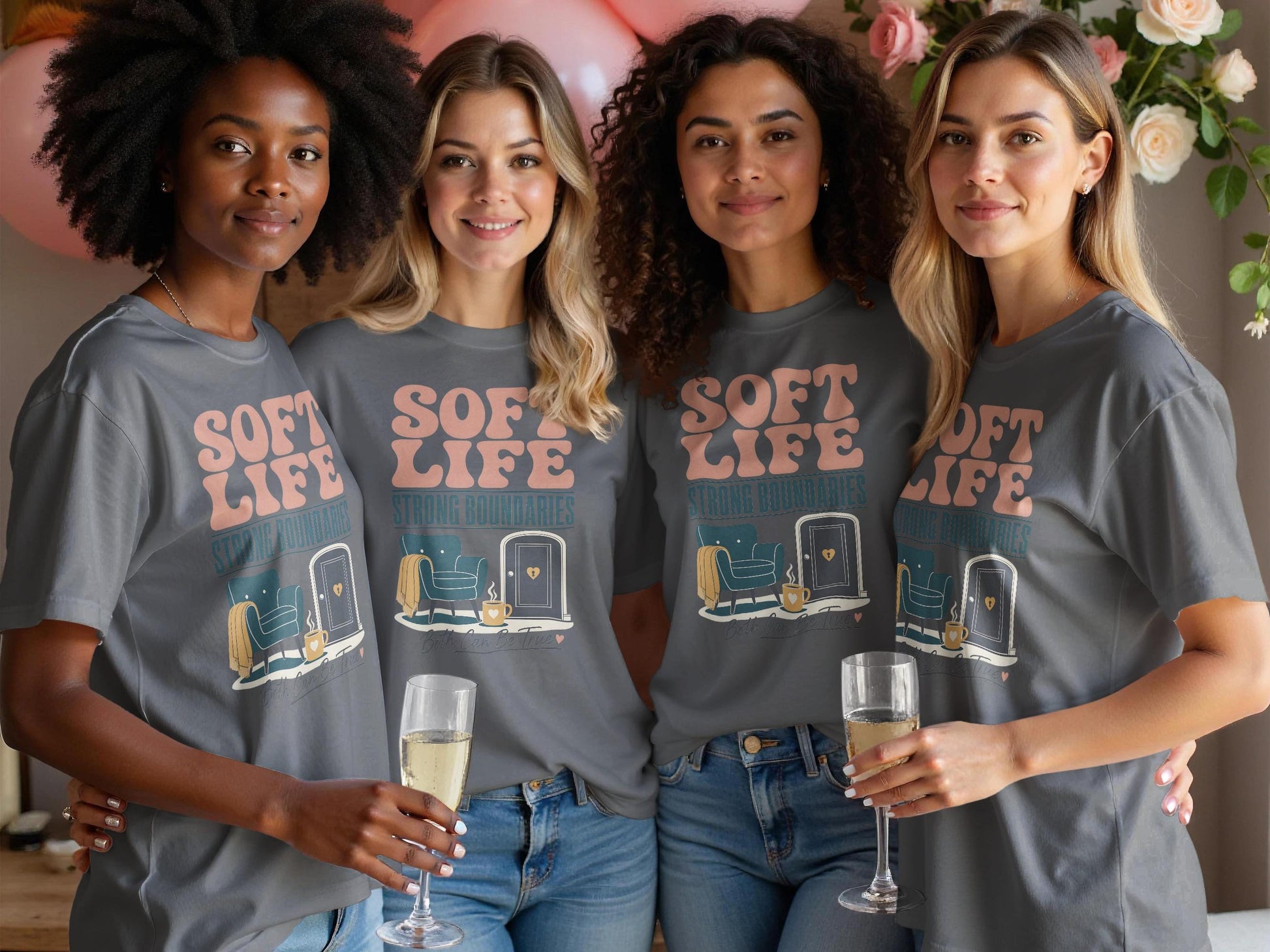 Four women in gray t-shirts with "Soft Life Strong Boundaries" graphic.