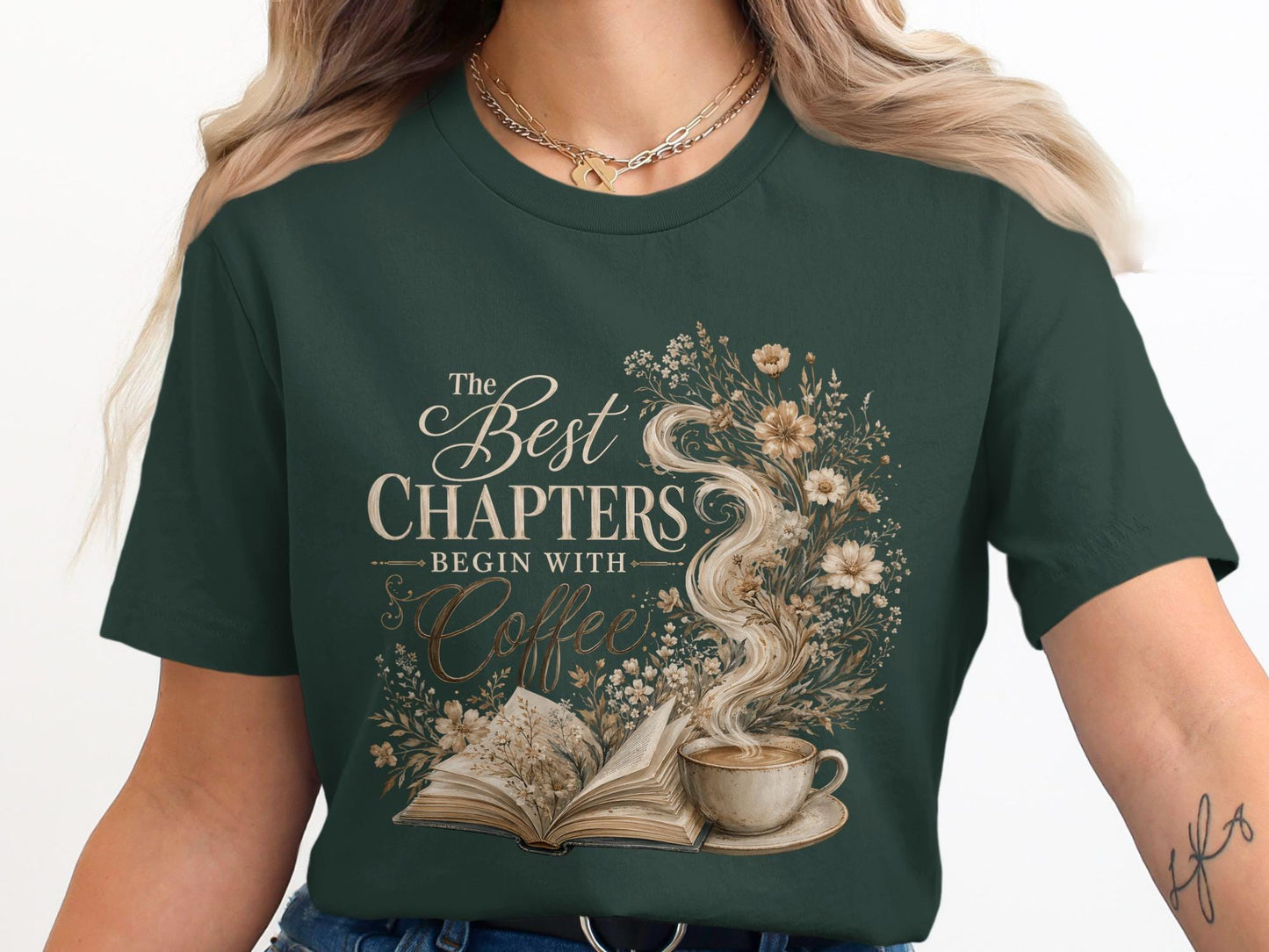 T-shirt with "The Best Chapters Begin With Coffee" text design and floral elements.