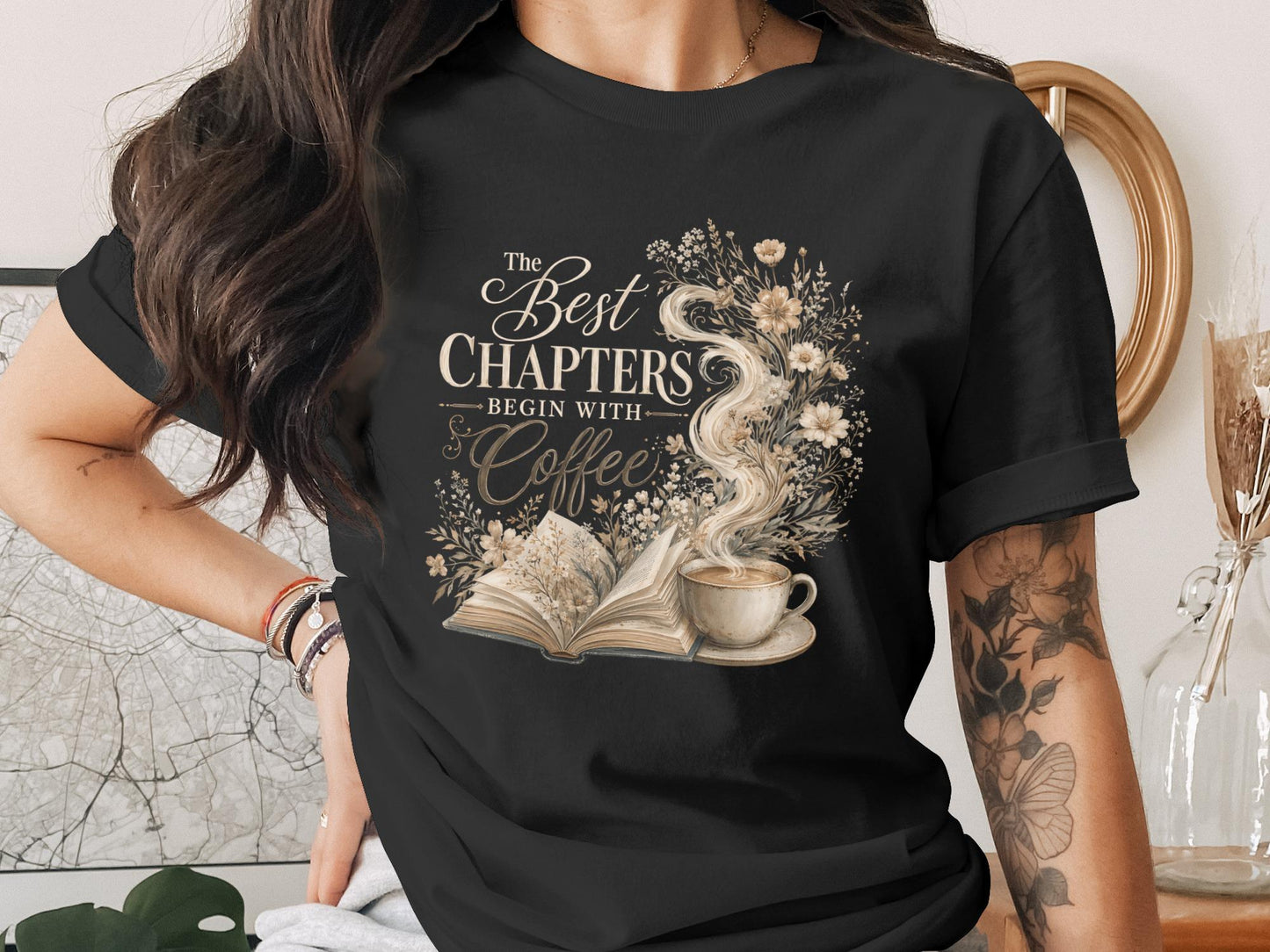 T-shirt with "The Best Chapters Begin With Coffee" text, an open book, and coffee cup.