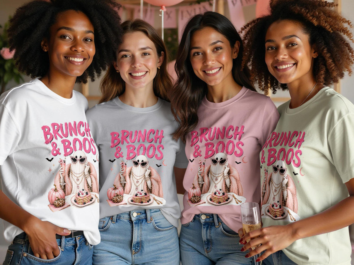 Four women wear t-shirts with a "Brunch & Boos" graphic of a ghost with pancakes.