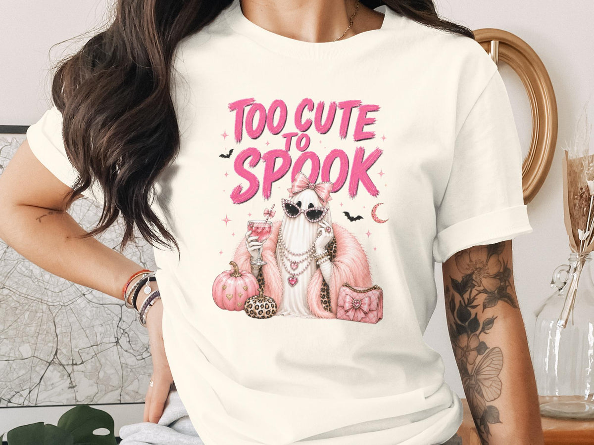 T-shirt with "Too Cute To Spook" text and a glamorous ghost graphic.