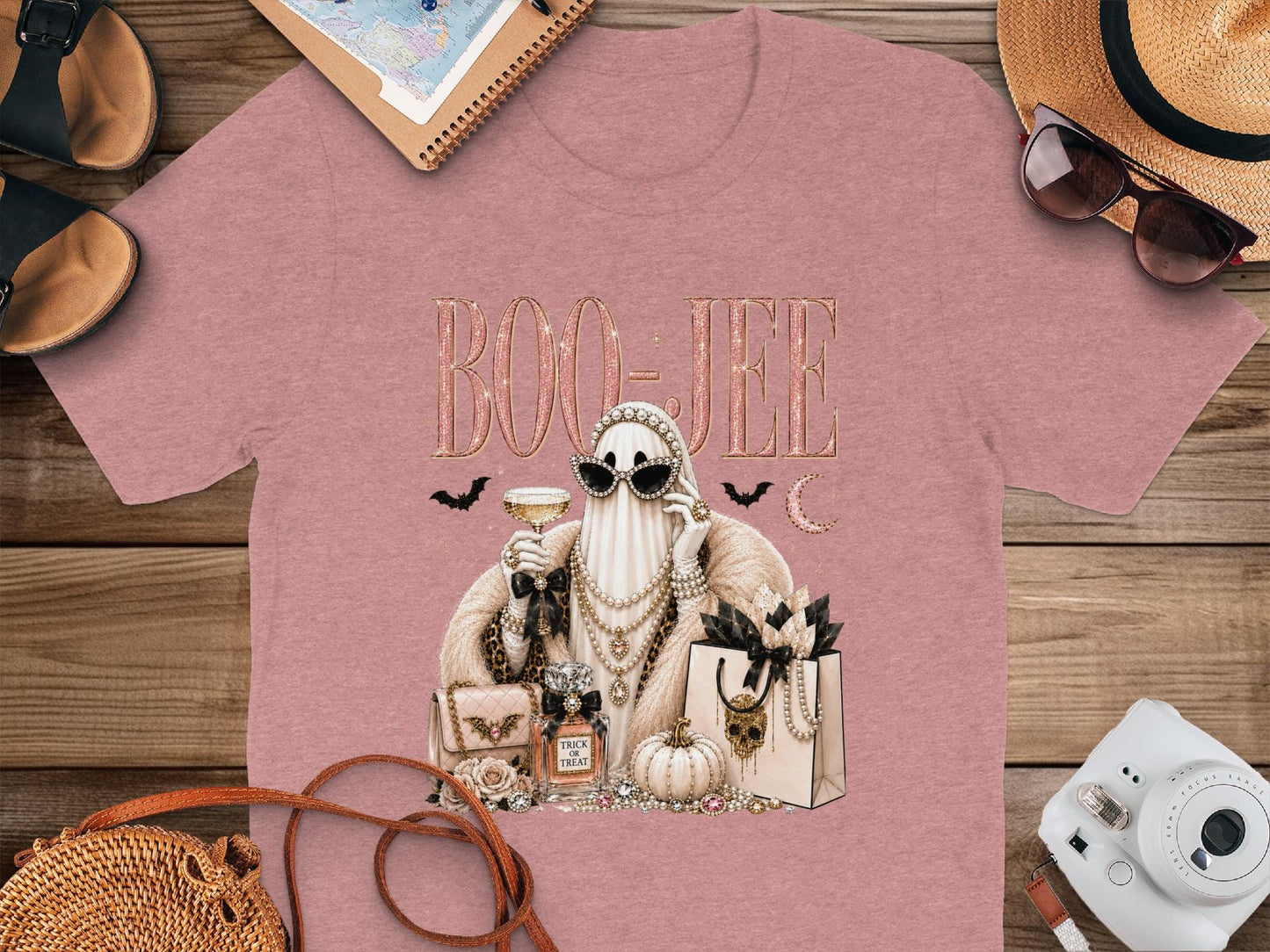 T-shirt with "BOO-JEE" text and a glamorous ghost holding a drink and accessories.