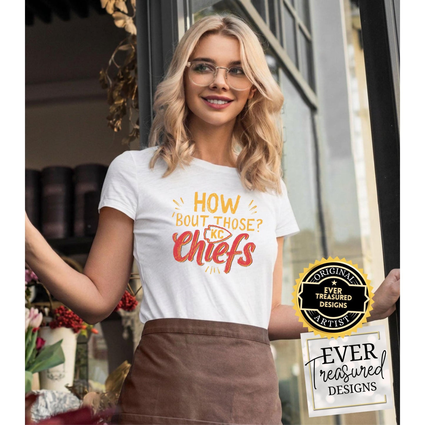 Woman in white t-shirt with "How 'Bout Those Chiefs" graphic and KC logo.